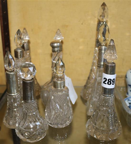 10 tall cut glass silver topped scent bottles
